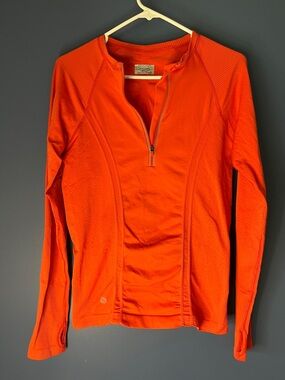 Athleta runner 9" front zip , long sleeve w thumb hole, bright orange, women med